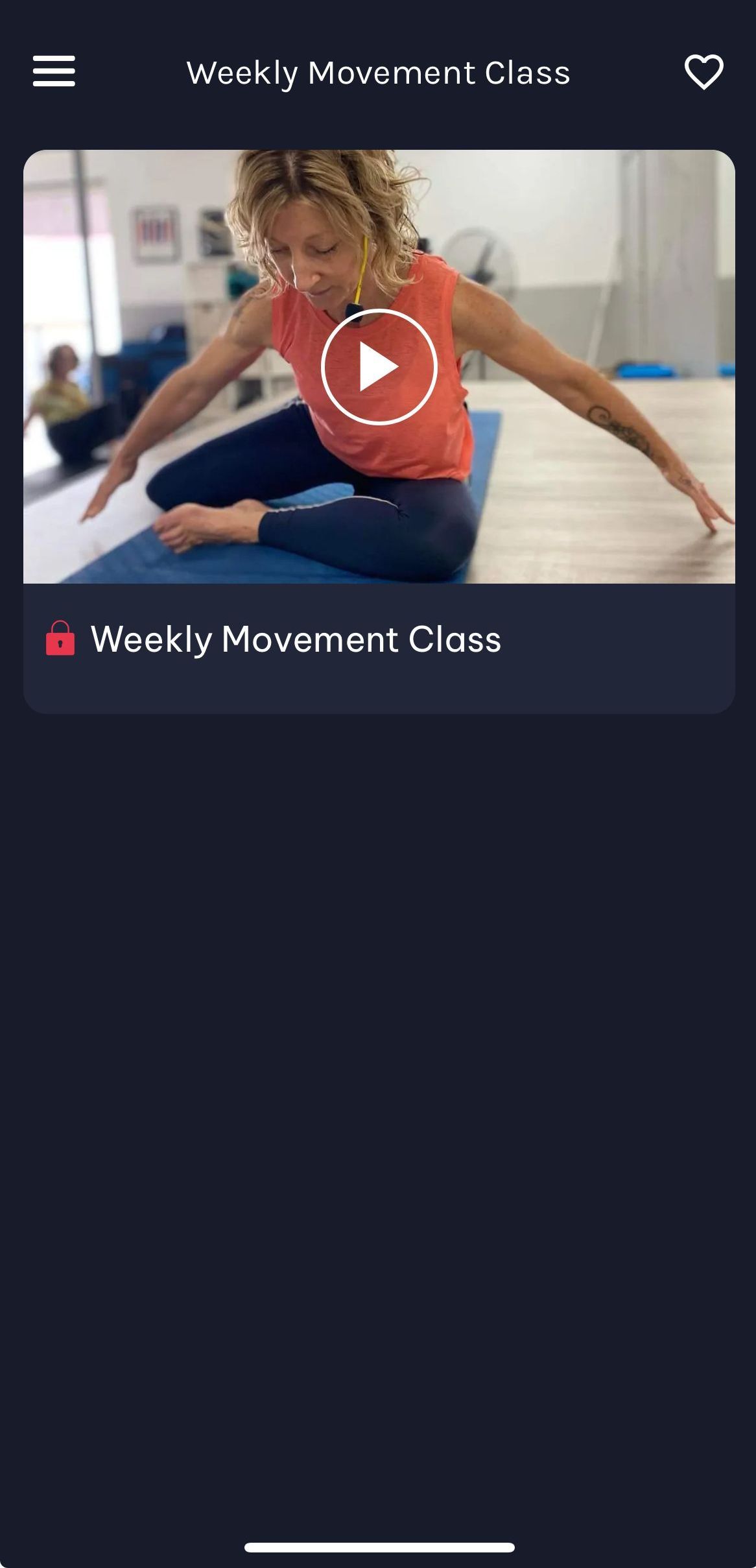 A woman is sitting on a yoga mat with her arms outstretched. movement evolution studio mobile app screen shot