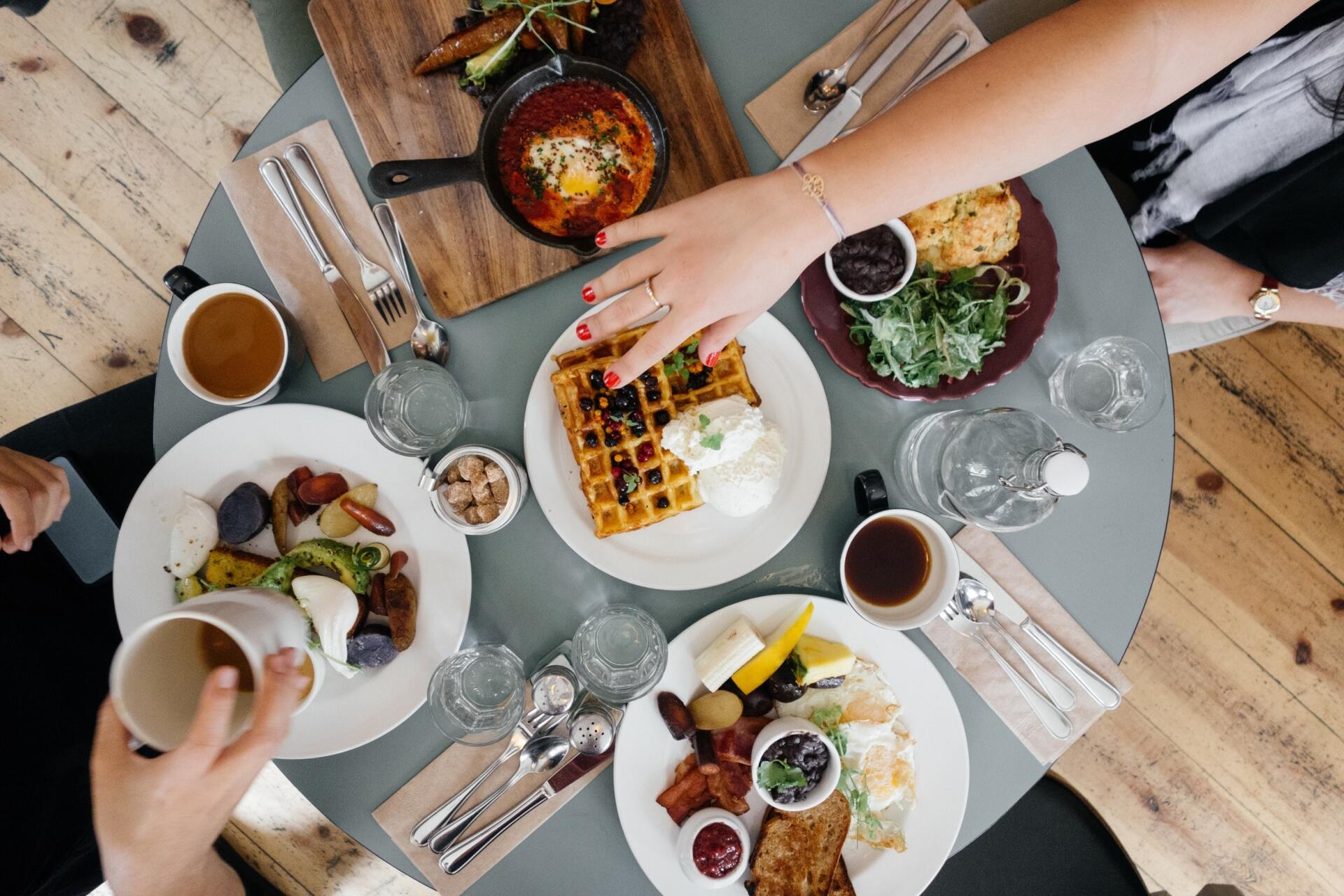 A group of people are sitting around after ordering food on a mobile app