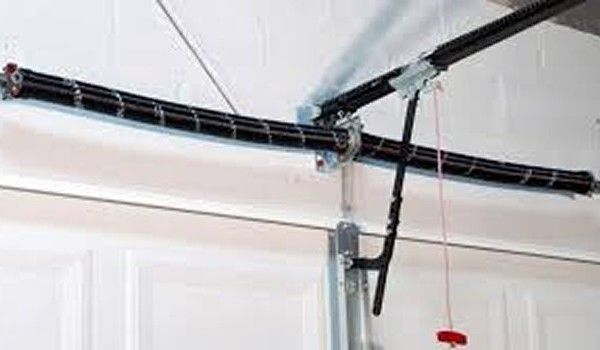 A close up of a garage door opener in a garage.