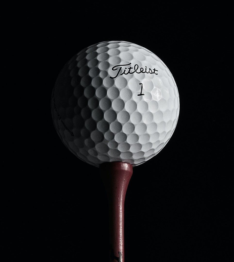 A white golf ball with the number 1 on it