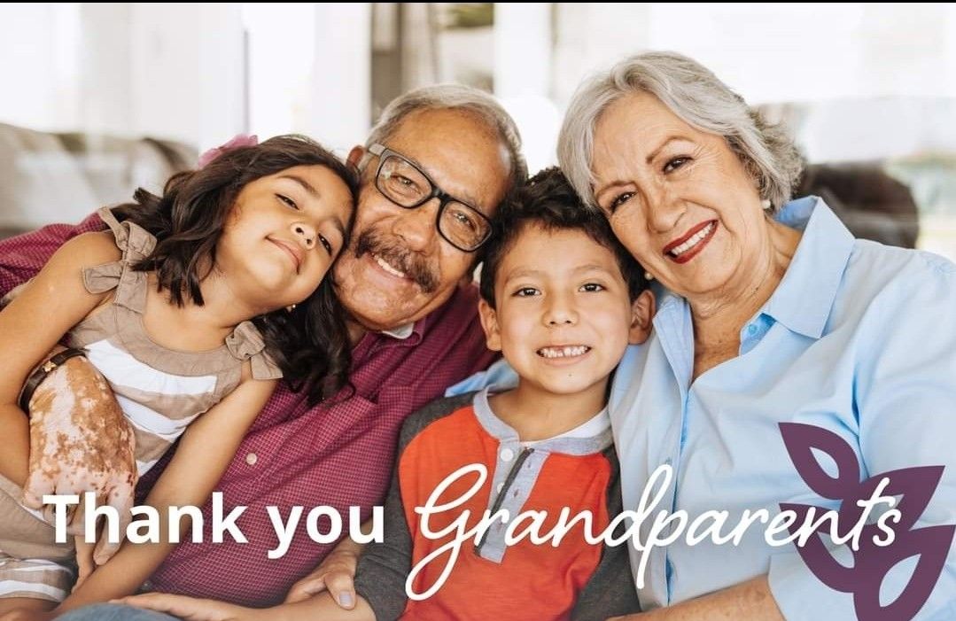 Family smiling together with “Thank you Grandparents” text overlay