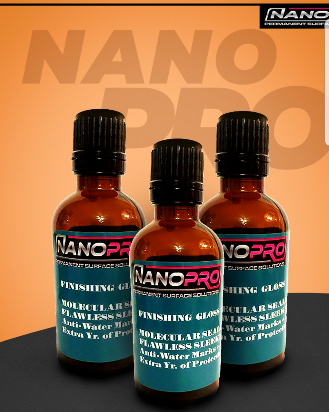 Three NanoPro bottles on a dark surface against an orange background
