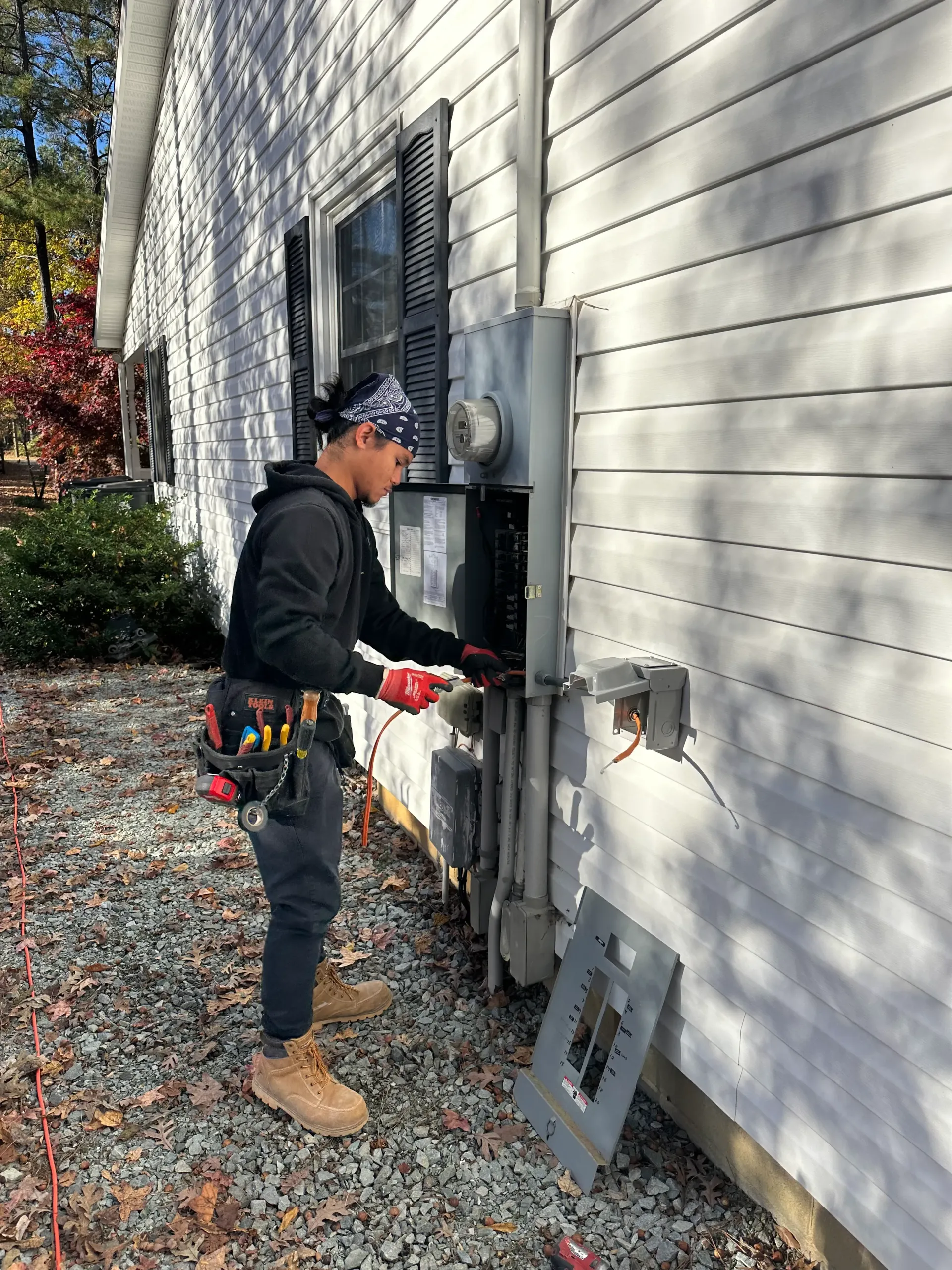 Ronnie Kluch wiring an electrical panel in Greensboro, NC