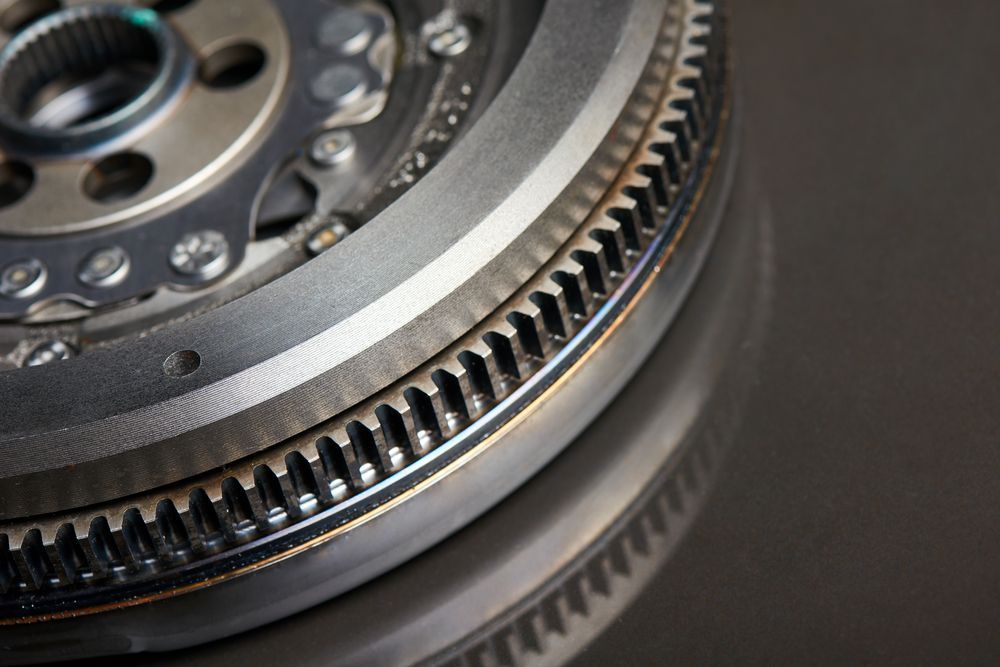 A Close Up Of A Metal Gear On A Black Surface — Torque Tech Supply & Repairs In Kempsey, NSW