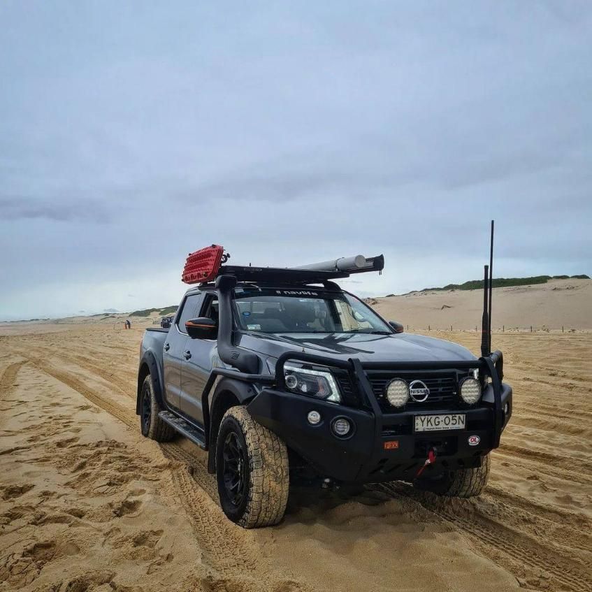 A Black Truck Is Parked On A Sandy Beach — Opposite Lock In Wodonga, VIC