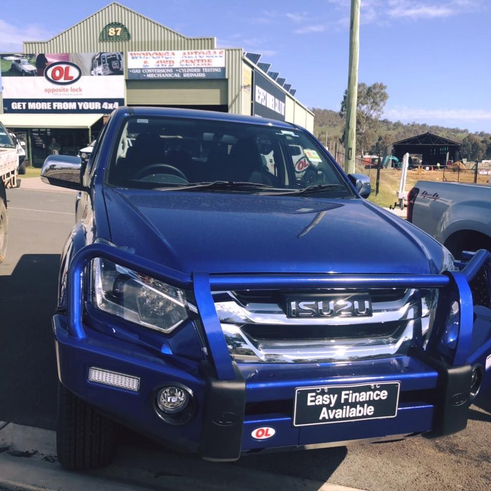 A Blue Isuzu Truck Is Parked In Front Of A Car Dealership — Opposite Lock In Wodonga, VIC