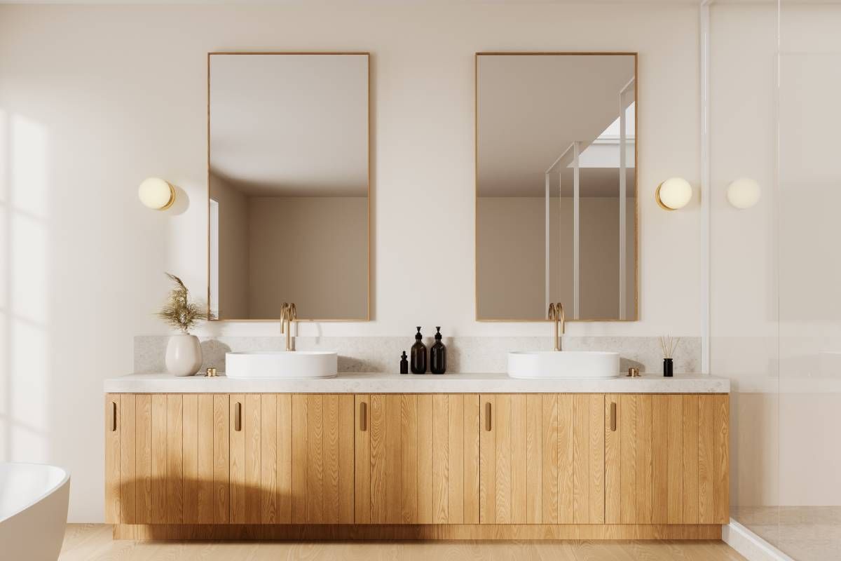 Two mirrors as part of a double vanity in a bathroom at Schön Interiors near Braunfels, Texas