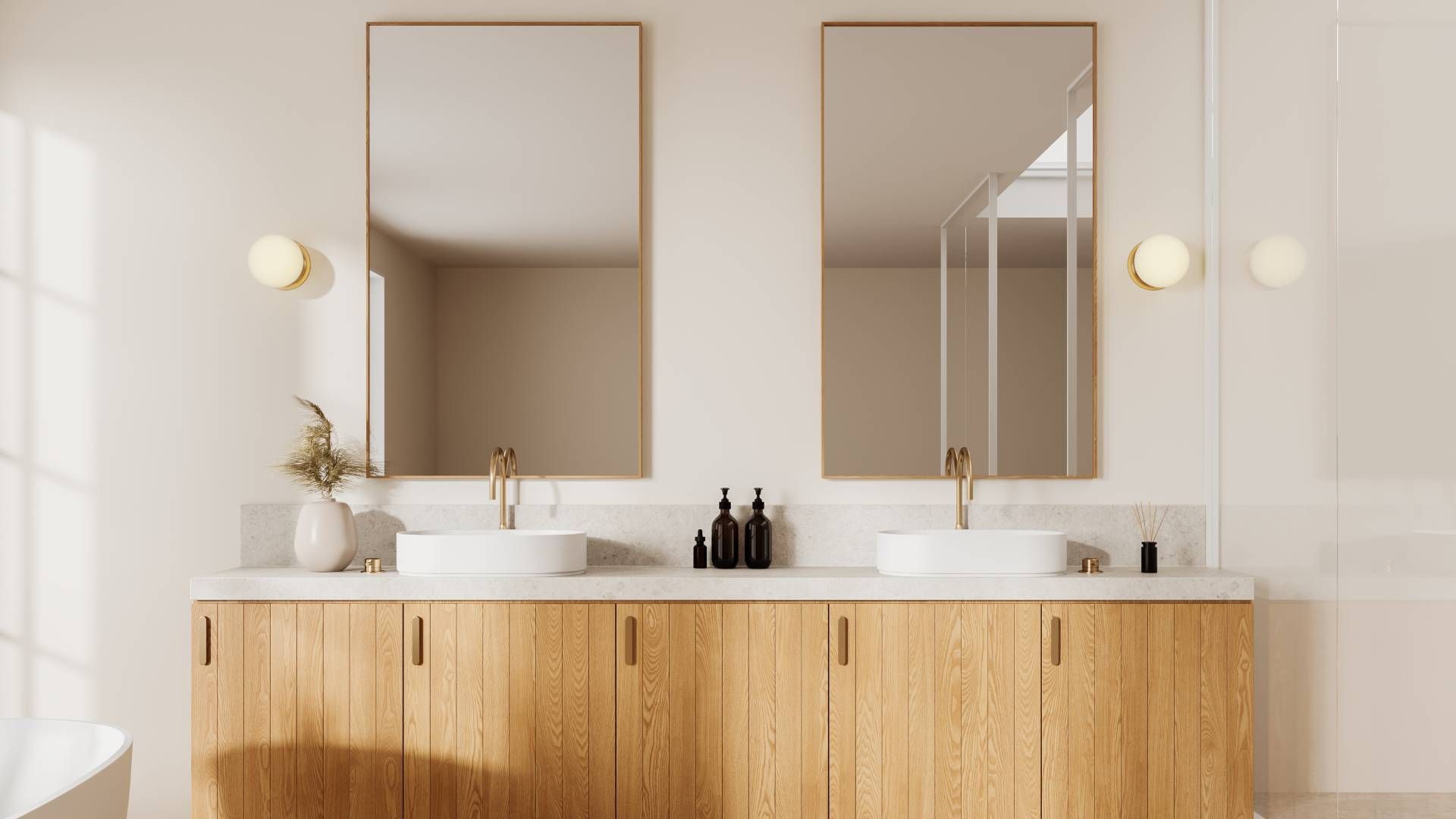 Two mirrors as part of a double vanity in a bathroom at Schön Interiors near Braunfels, Texas