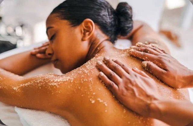 A woman is getting a massage at a spa