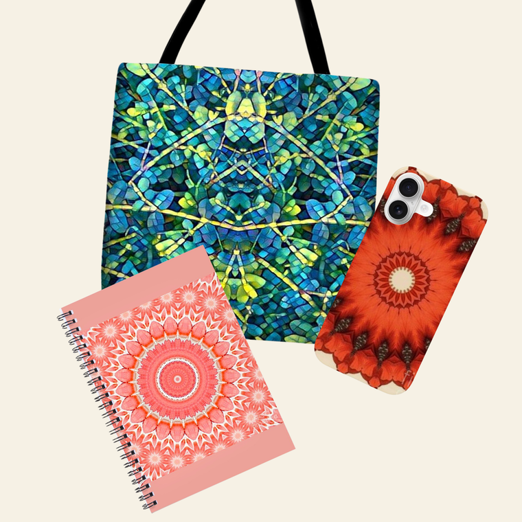 Colorful tote bag, floral phone case, and pink spiral notebook on a white background