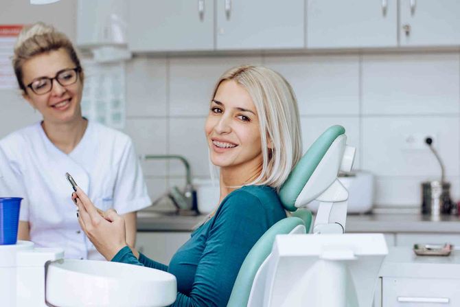 A patient using her phone — Stuttgart, AR — The Dental Clinic of Stuttgart