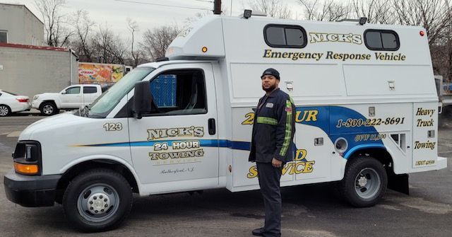 Jose Cabrera of Wallington Truck Repair with Nick's Road Service vehicle, providing roadside assistance in Bergen County.