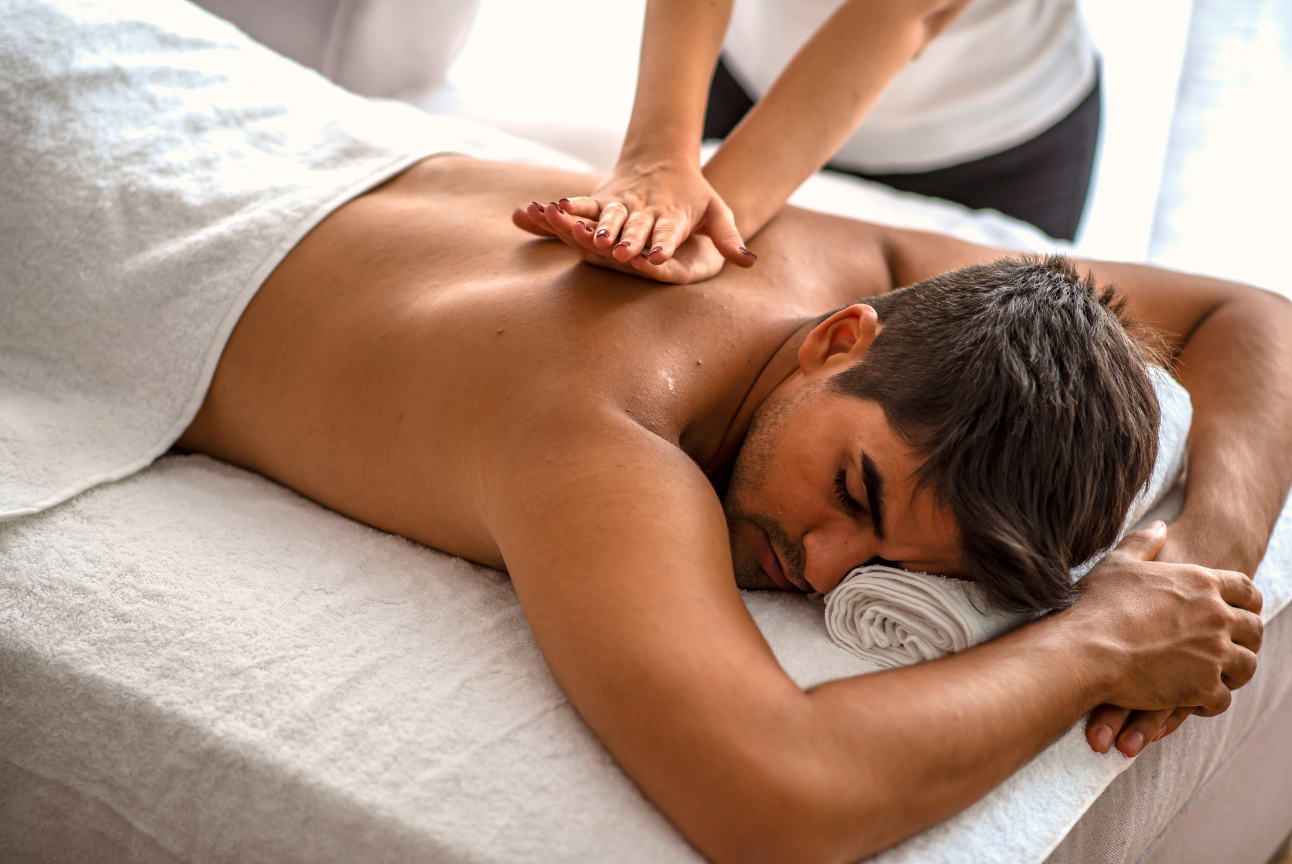 A man is getting a massage at a spa.