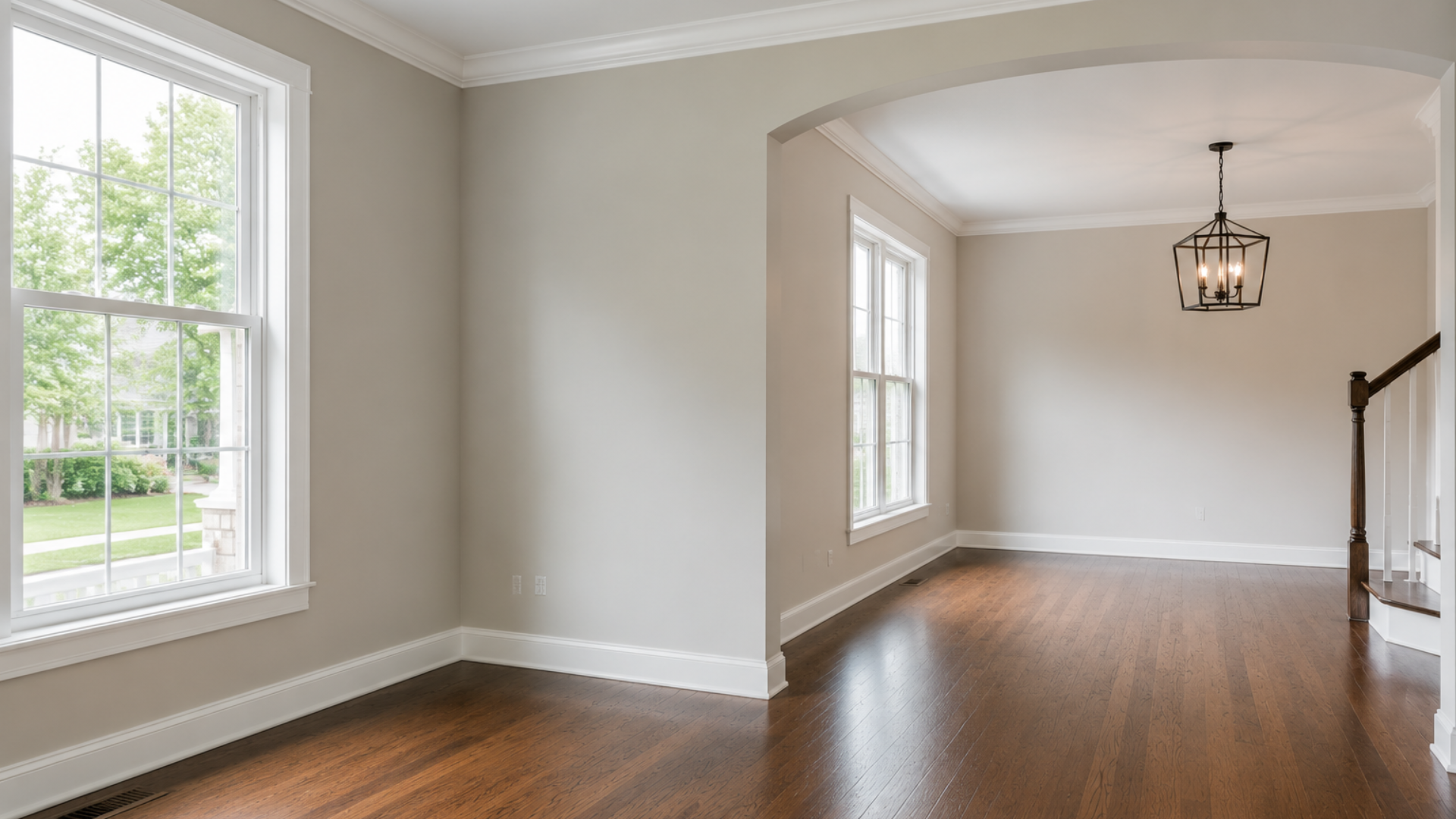 A room under renovation with a rustic wood-plank accent wall, unfinished walls and ceiling, and a dark doorway.