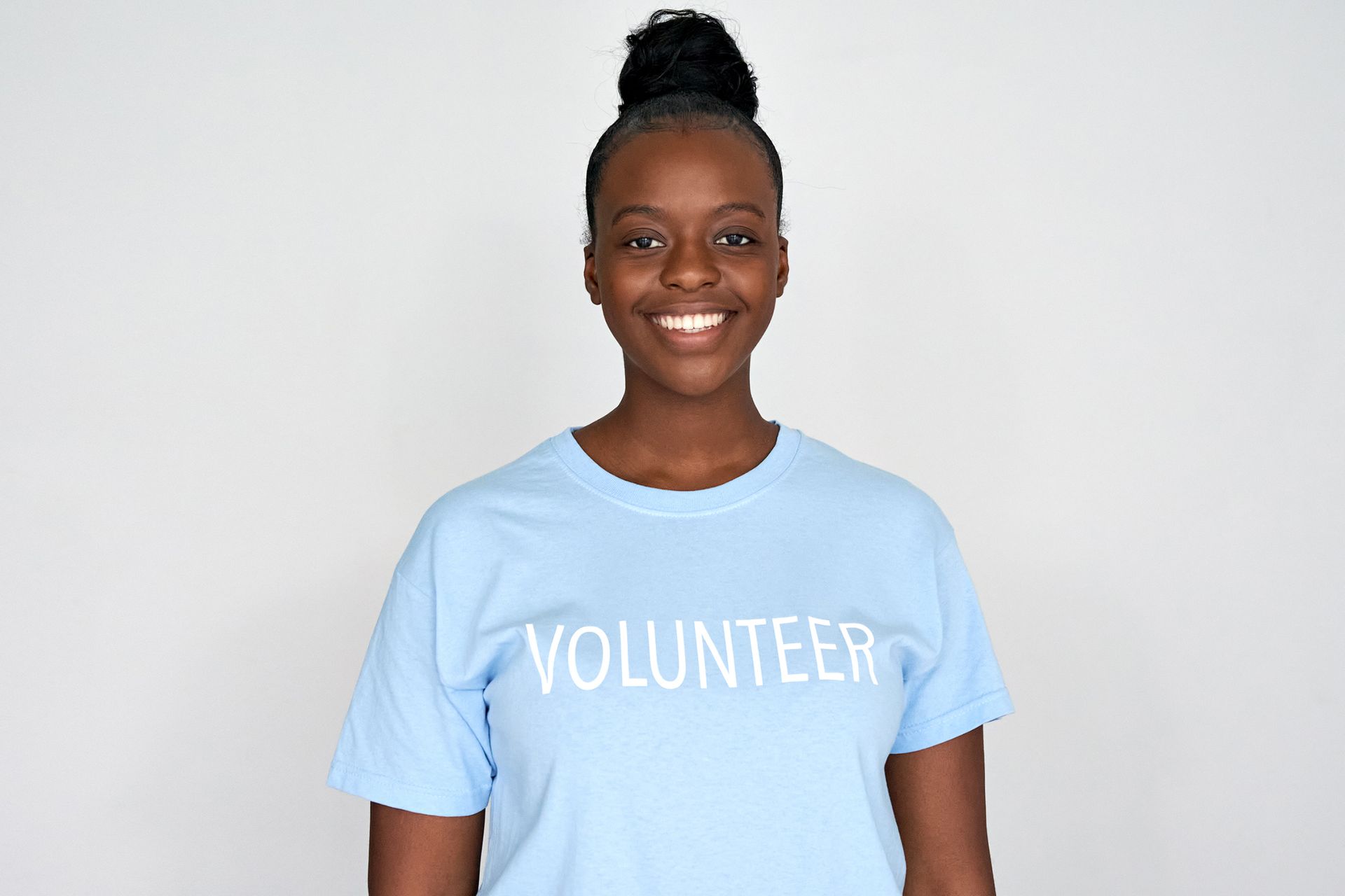 Happy young african american woman activist wears volunteer tshirt