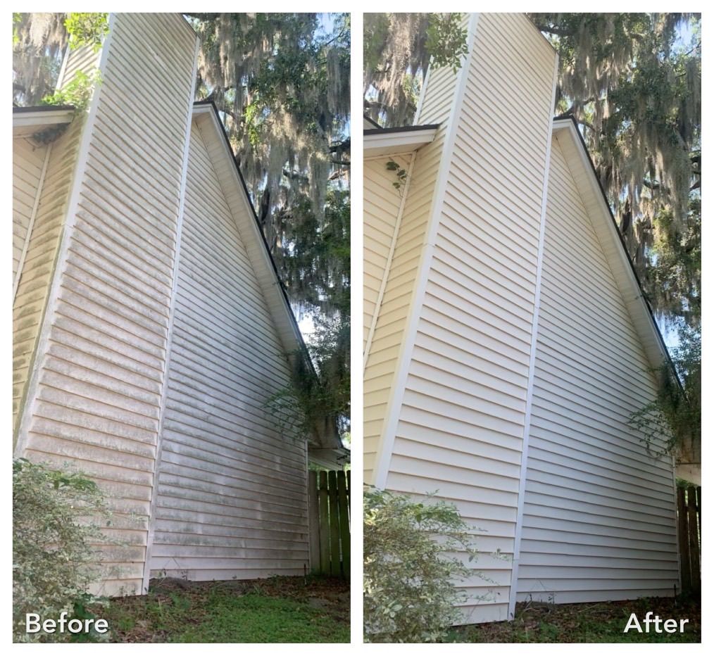 A before and after photo of a house 's siding being cleaned.