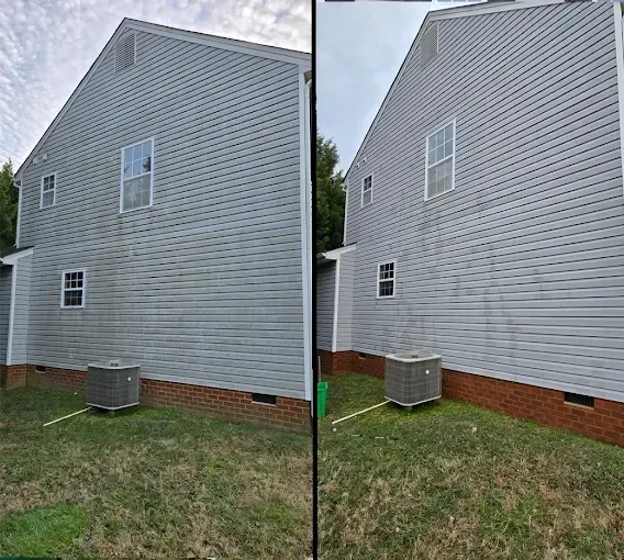 Side-by-side view of a house. One side is dirty, the other is clean, after being power washed.
