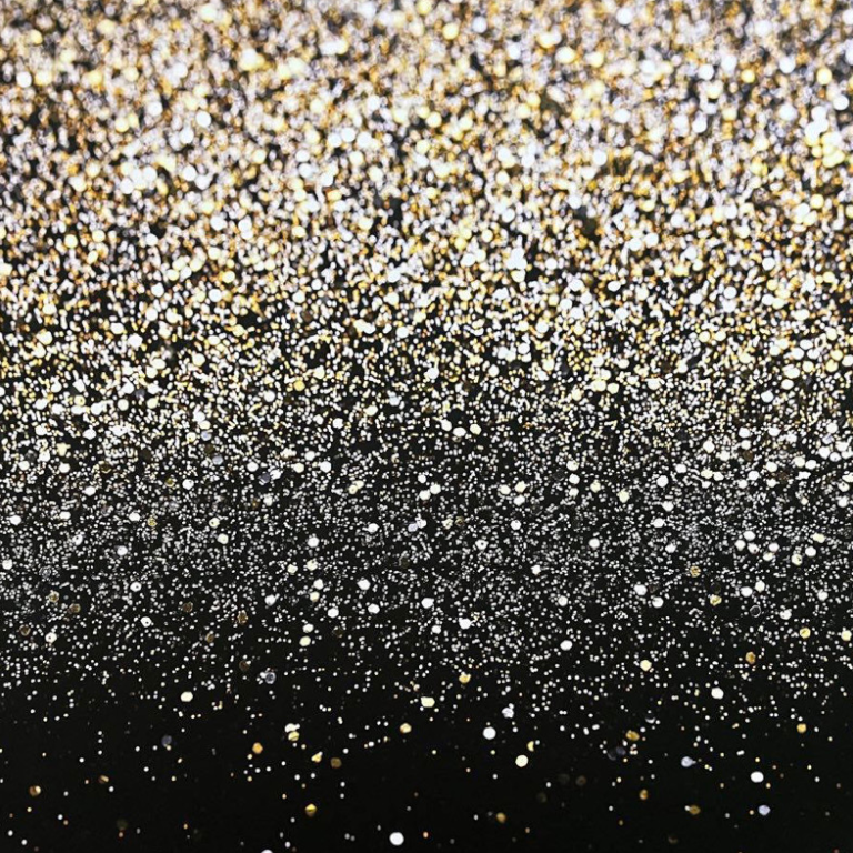 Gold spots on black background backdrop