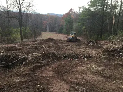 Two Bulldozers are Working on a Dirt Field — Julian, PA — Aikey’s Tree Service Land Clearing — Julian, PA — Aikey’s Tree Service