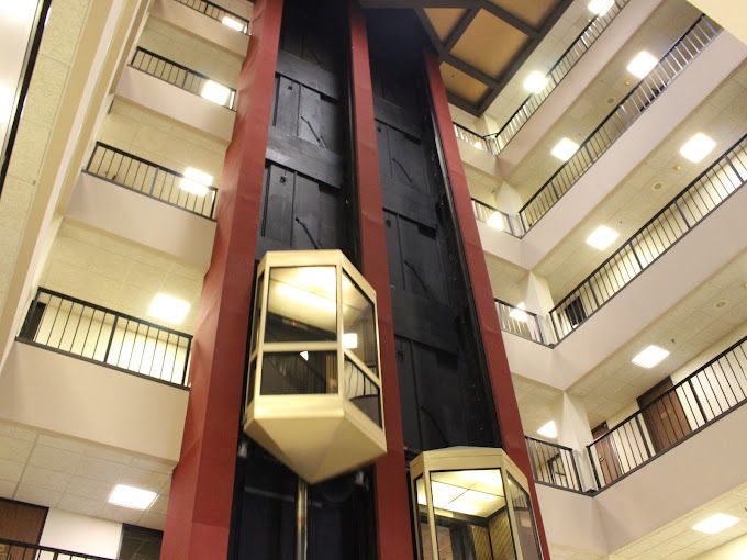 An elevator in the middle of a large building