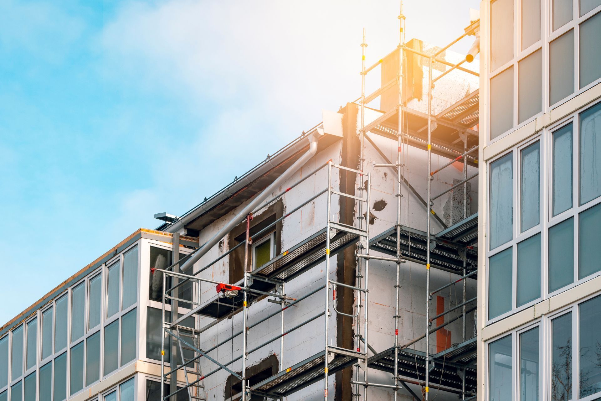 A building under construction with scaffolding on the side of it.