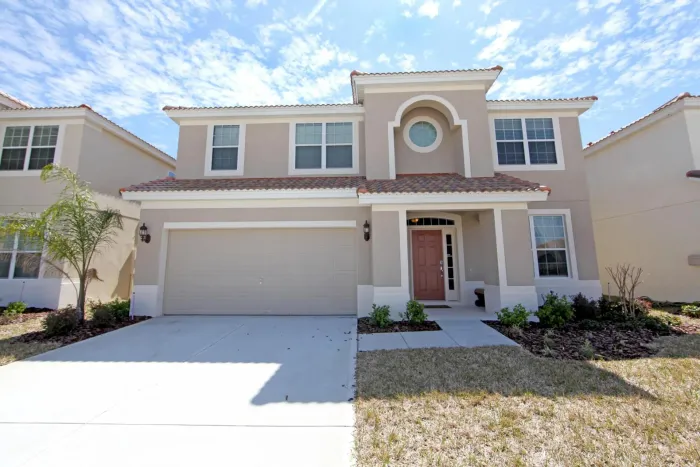 A large house with a circular window in the front