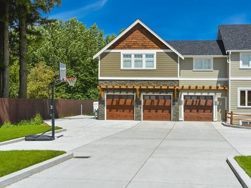 A house with a basketball hoop in front of it