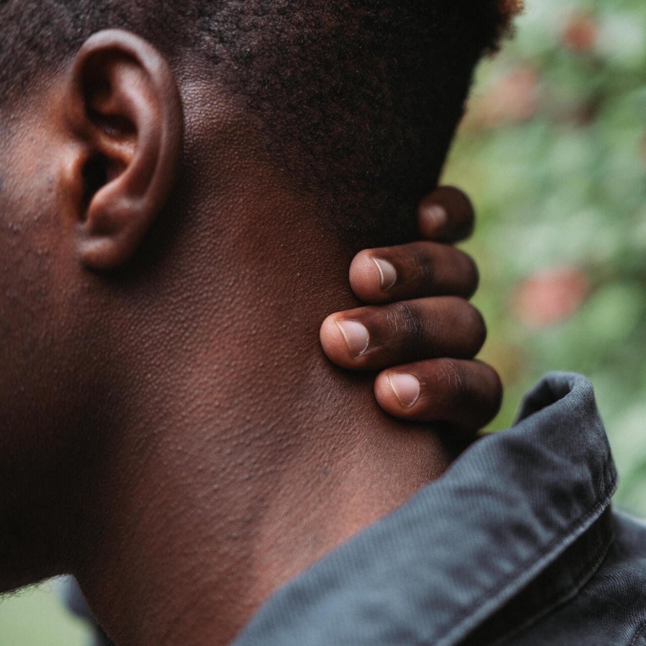 Man holding his neck with Whiplash