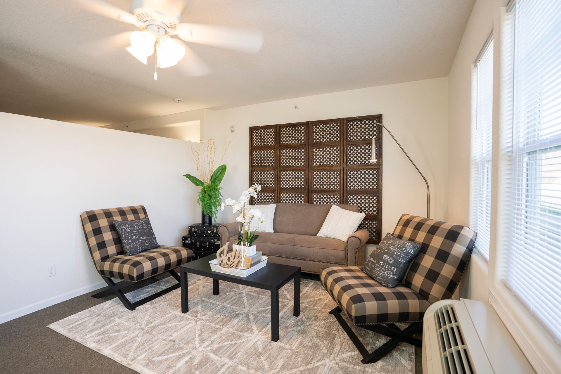 Alternate view of nice white room with pretty furniture with 2 chairs