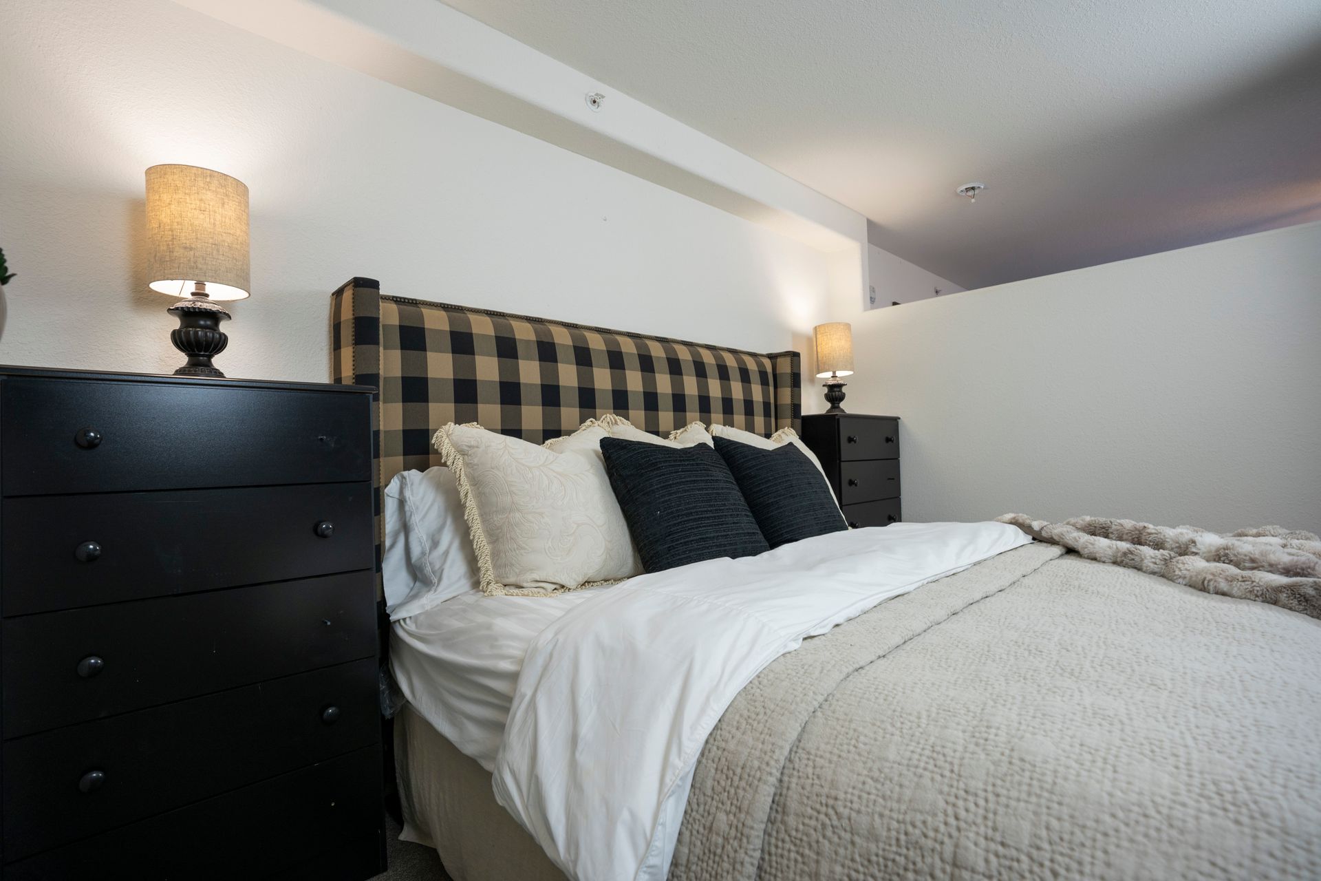 bedroom with pretty bed and side table