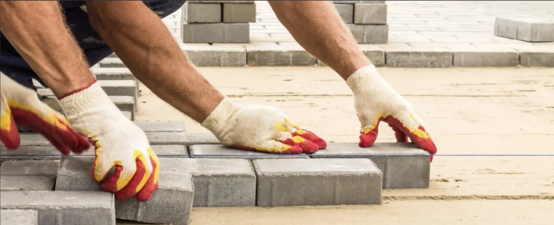 An image of cement sand bricks neatly stacked together, commonly used for modern construction.