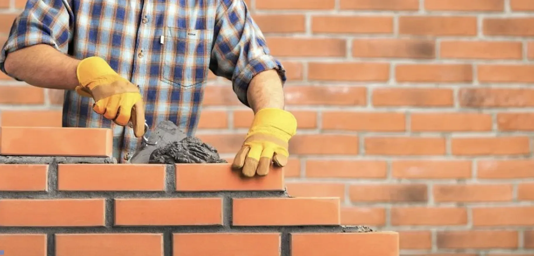 An image of common clay bricks arranged in a stack. Showcasing their smooth surfaces, often used in traditional construction.
