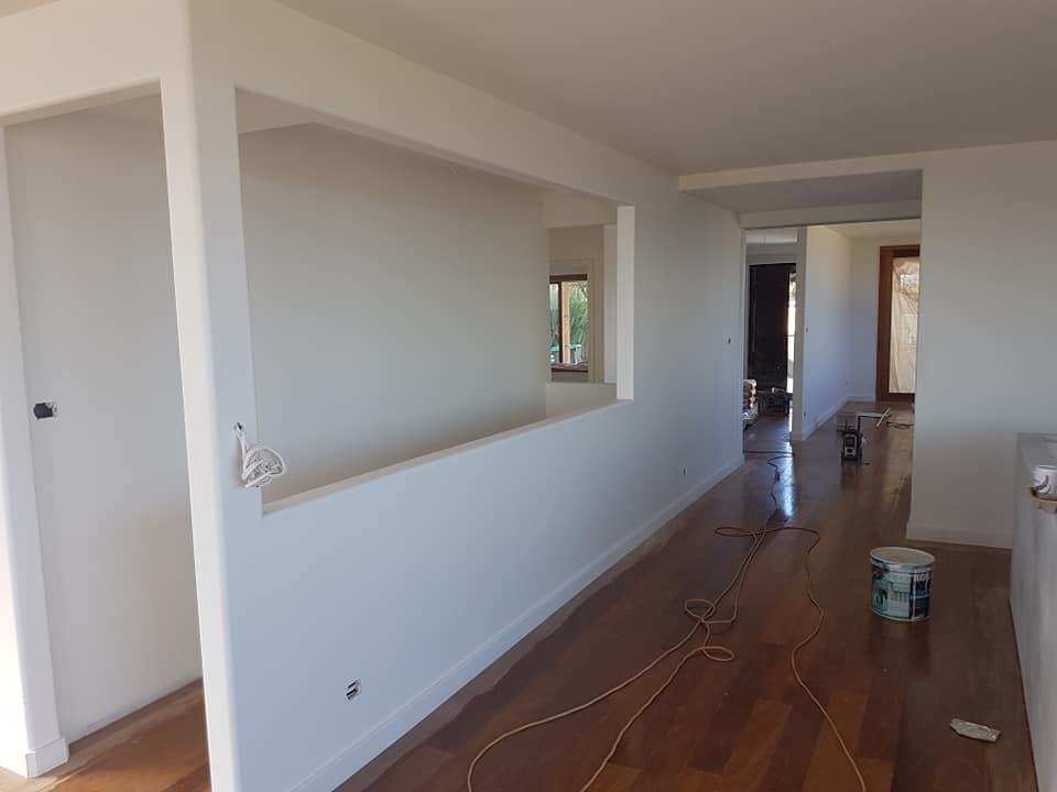 Empty Hallway With White Walls, Wood Floor, and a Large Interior Opening — Damien Thompson Plastering King Creek, NSW