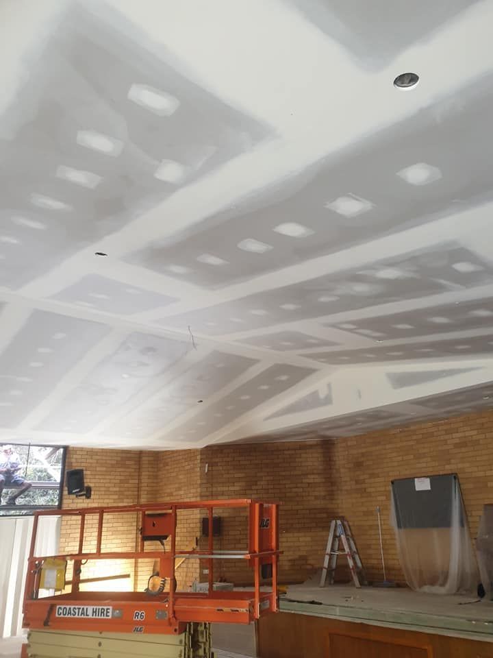 Interior Under Construction With Drywall Ceiling Patches and Brick Walls — Damien Thompson Plastering King Creek, NSW