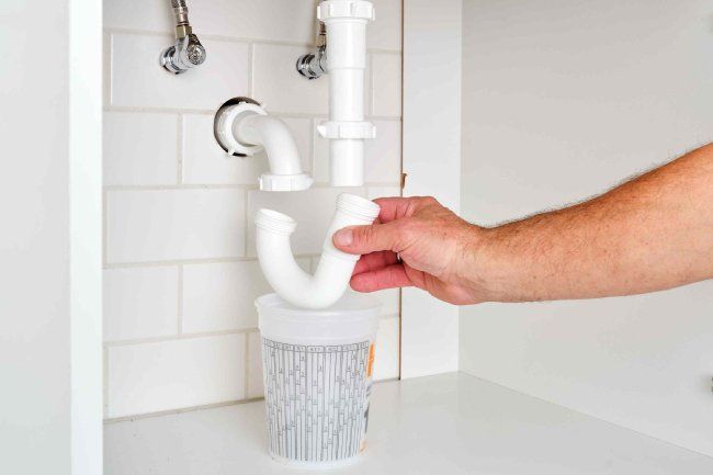 cleaning the P-trap sink pipe