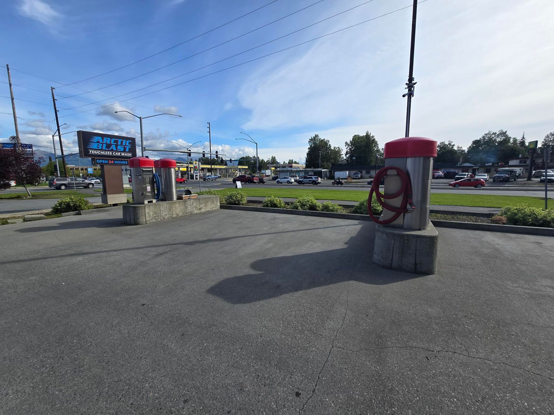 A parking lot with a sign that says ' pepsi ' on it