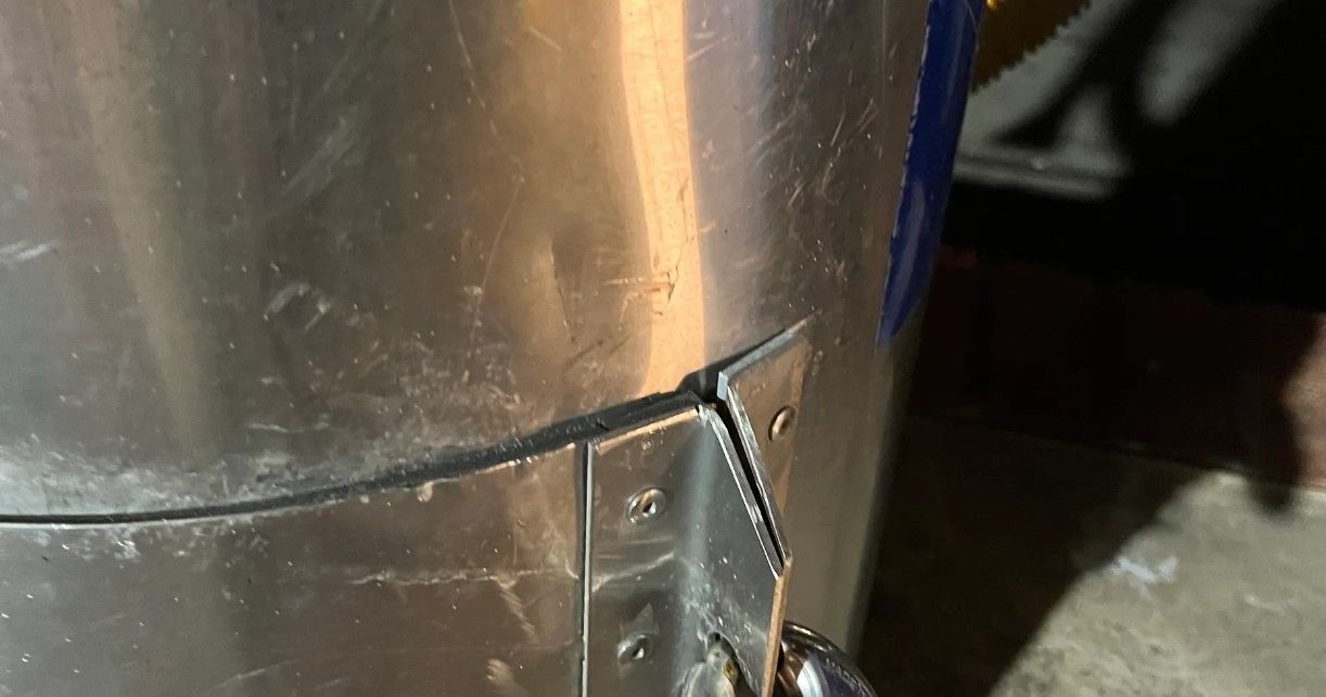 A close up of a metal object with a hole in it.