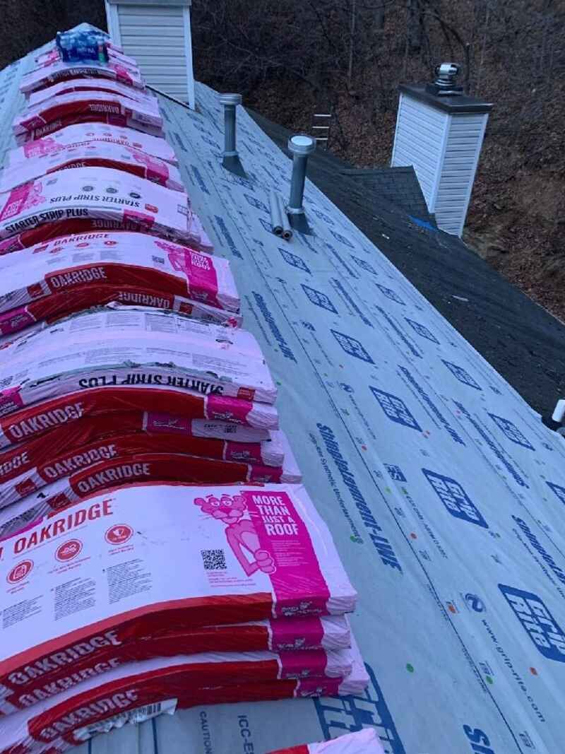 A stack of bags sitting on top of a roof.