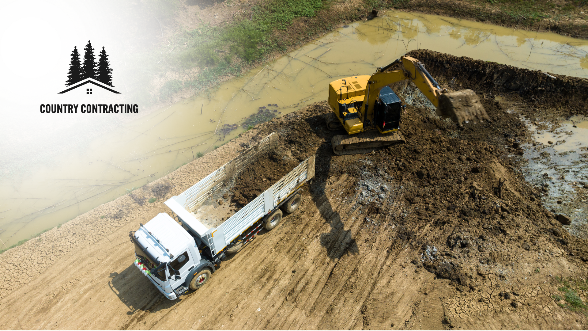 An aerial view of a construction site with a truck and an excavator.