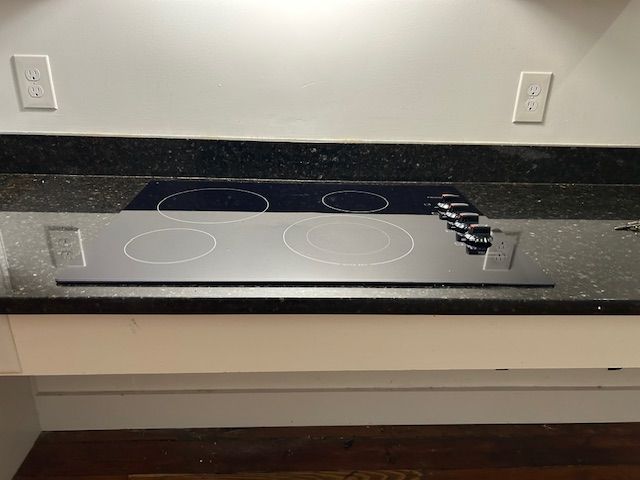 New, black glass Drop-in stove Top