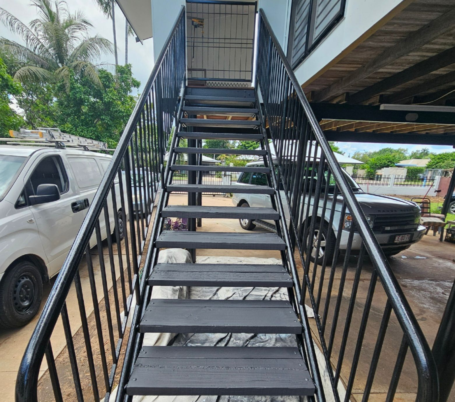 Black metal exterior staircase leading upwards — Prestige Painting NT in Zuccoli, NT
