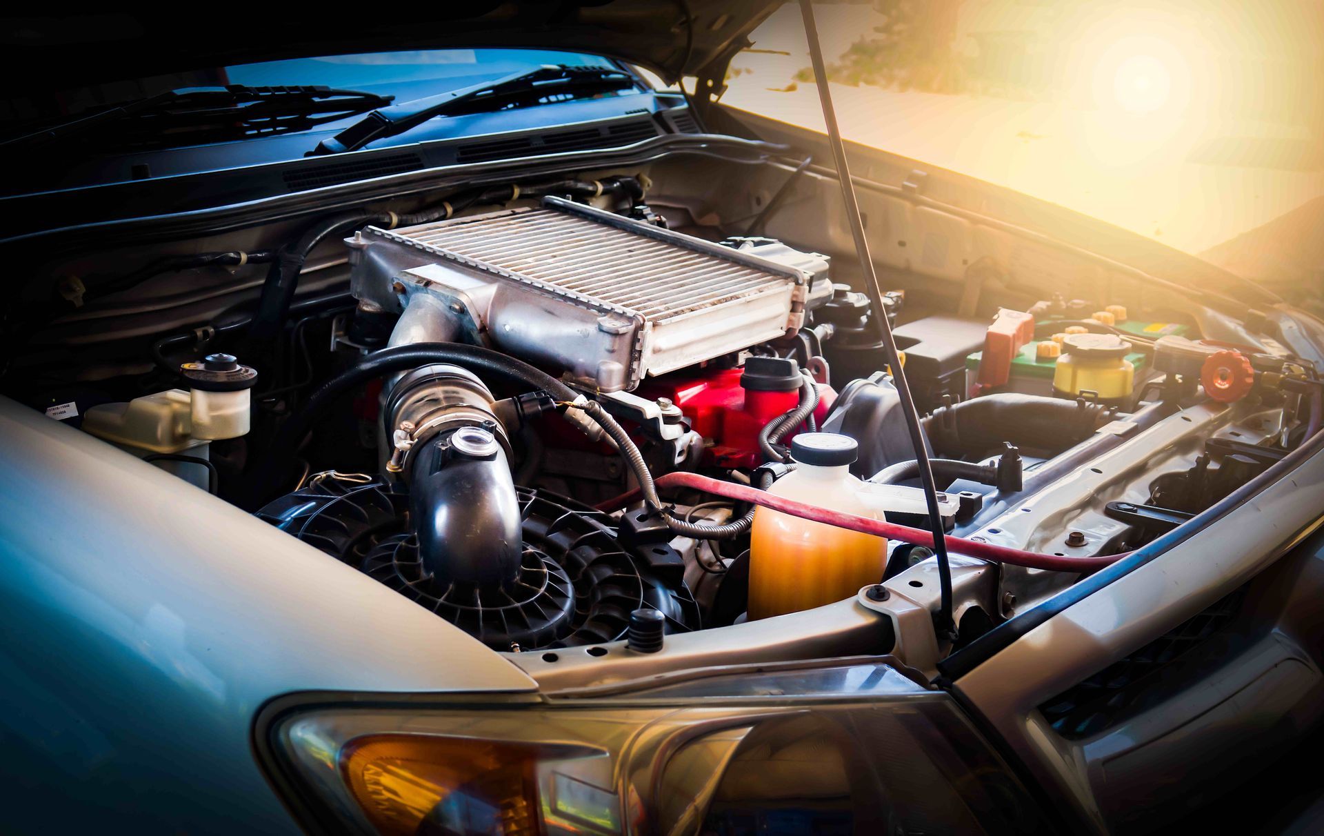 the hood of a car is open and the engine is visible