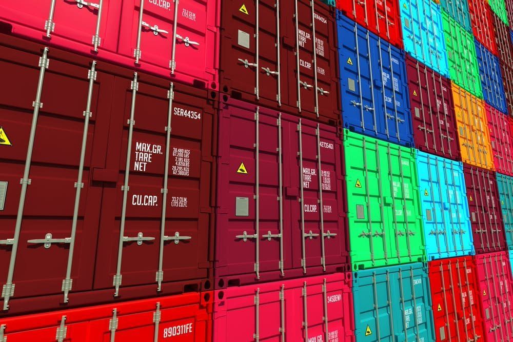 A Row Of Colourful Shipping Containers Are Stacked On Top Of Each Other — Brisbane Moving & Storage In Acacia Ridge, QLD