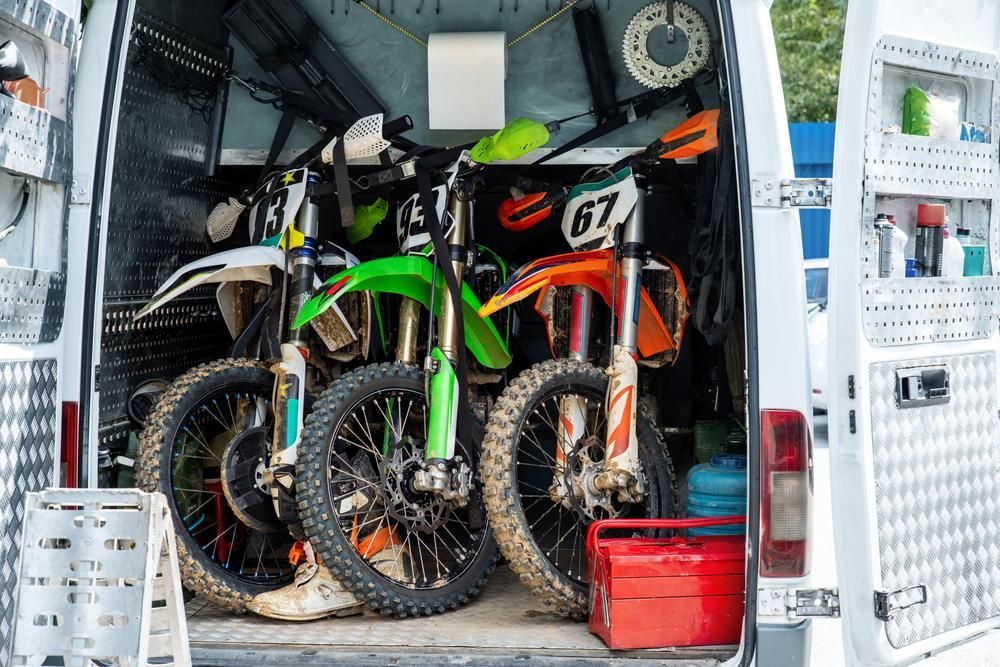 Two Dirt Bikes Are Sitting In The Back Of A Van — Brisbane Moving & Storage In Acacia Ridge, QLD