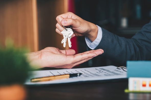 real-estate-agent-handing-over-keys