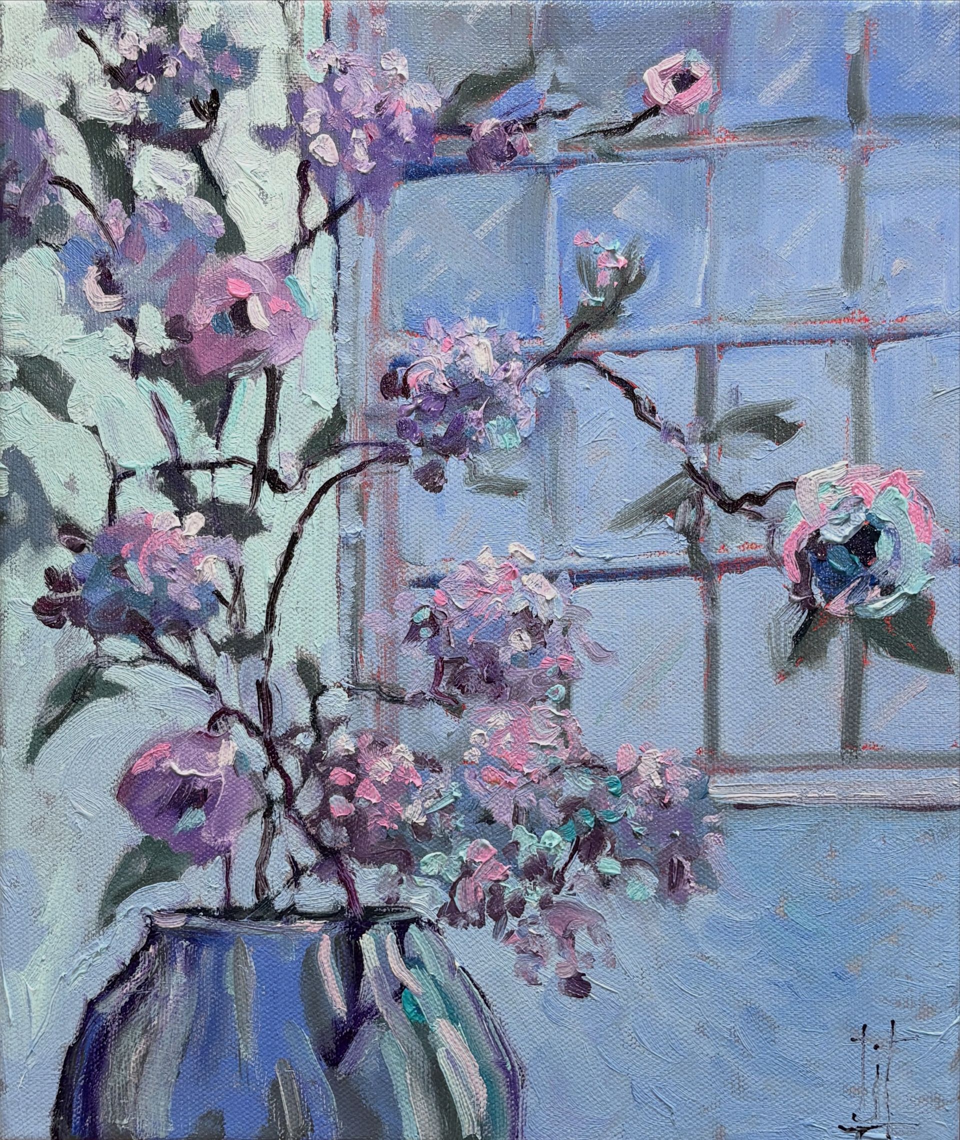 Blue flowers in a window tinged with pinks