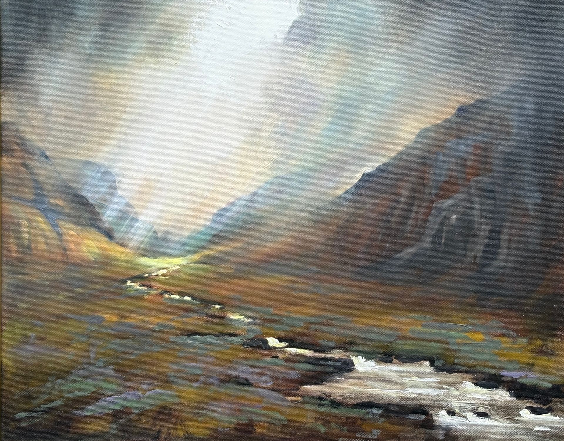 An oil painting of Glencoe with light breaking through the clouds.