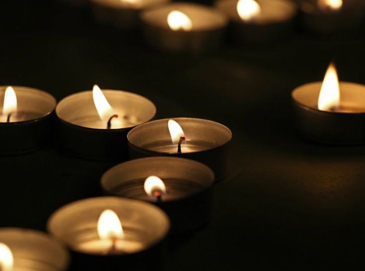 Lit candles representing remembrance during cremation services in Chandler, AZ.
