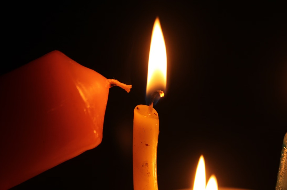 Memorial candles symbolizing shared remembrance after cremation in Gilbert, AZ.