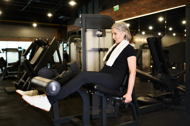 mature woman at a gym exercising